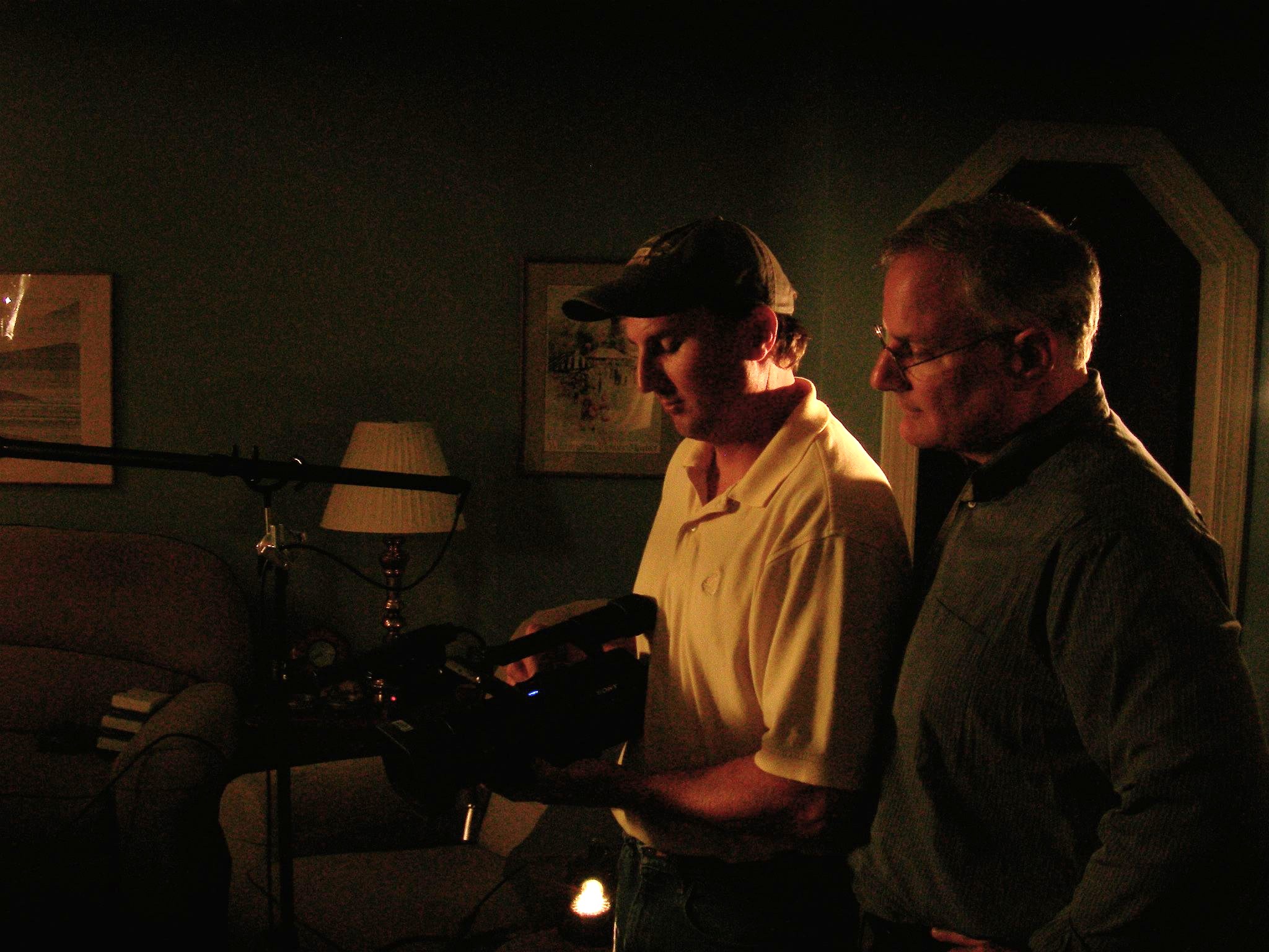 Paul Skomal checks shot with producer